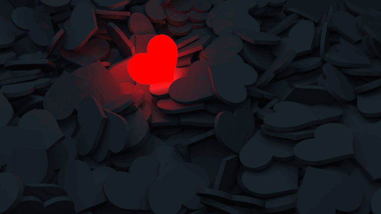 a lonely red heart surrounded by black hearts