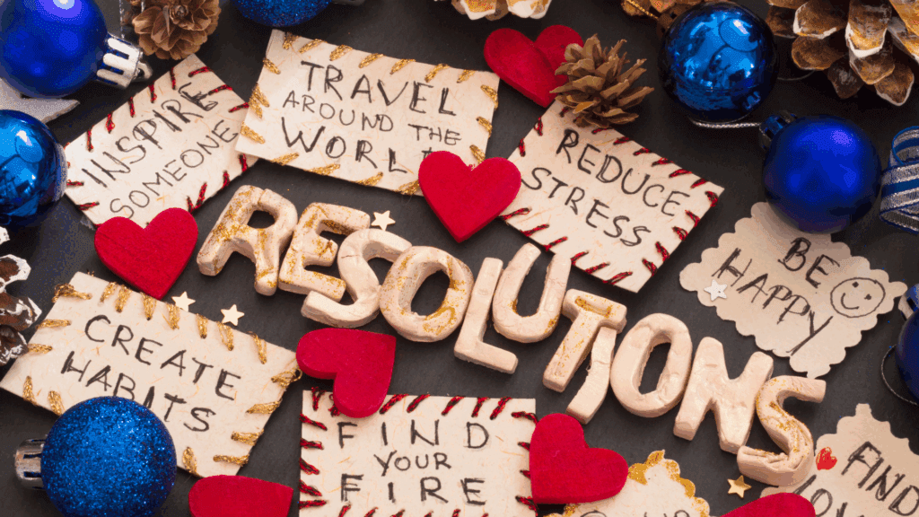 New Year's Resolutions with Holiday Decorations
Alt Text: A collage of holiday-themed New Year's resolutions with handwritten goals surrounded by hearts, ornaments, and pinecones.
