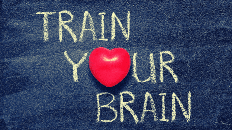 Chalkboard-style image that reads Train Your Brain with a heart symbol, representing the emotional and cognitive benefits of daily neurofitness routines.