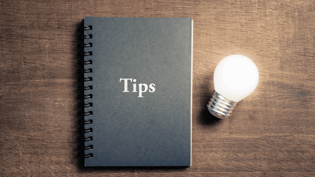 Notebook labeled tips and a lightbulb, symbolizing practical advice from the neuroscience of perspective