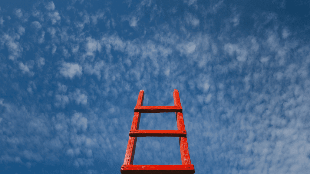 A red ladder reaching toward the sky symbolizes rising levels of dopamine and personal growth.
