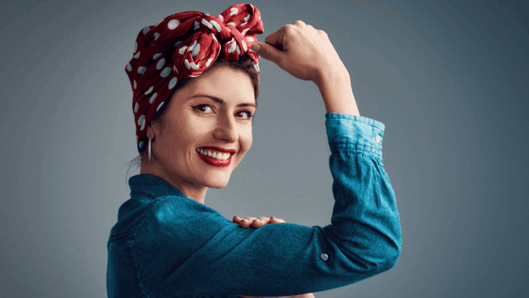 A person in a denim shirt flexing their arm, symbolizing hyper independence and inner strength.