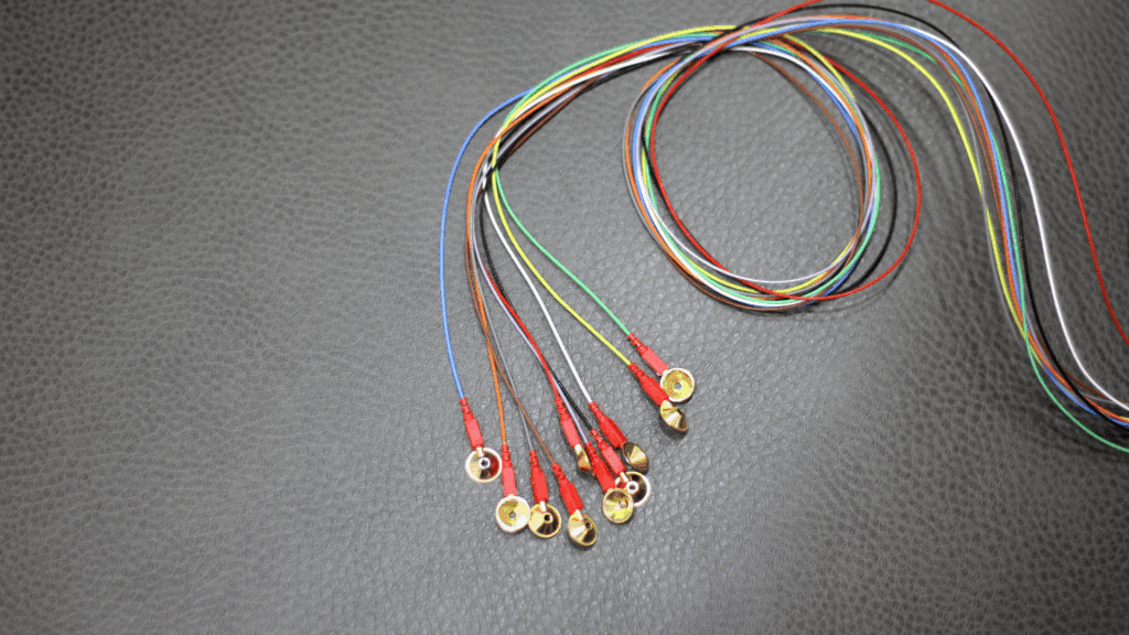 Colorful EEG wires used to study brain activity, essential for understanding the neuroscience of anxiety.