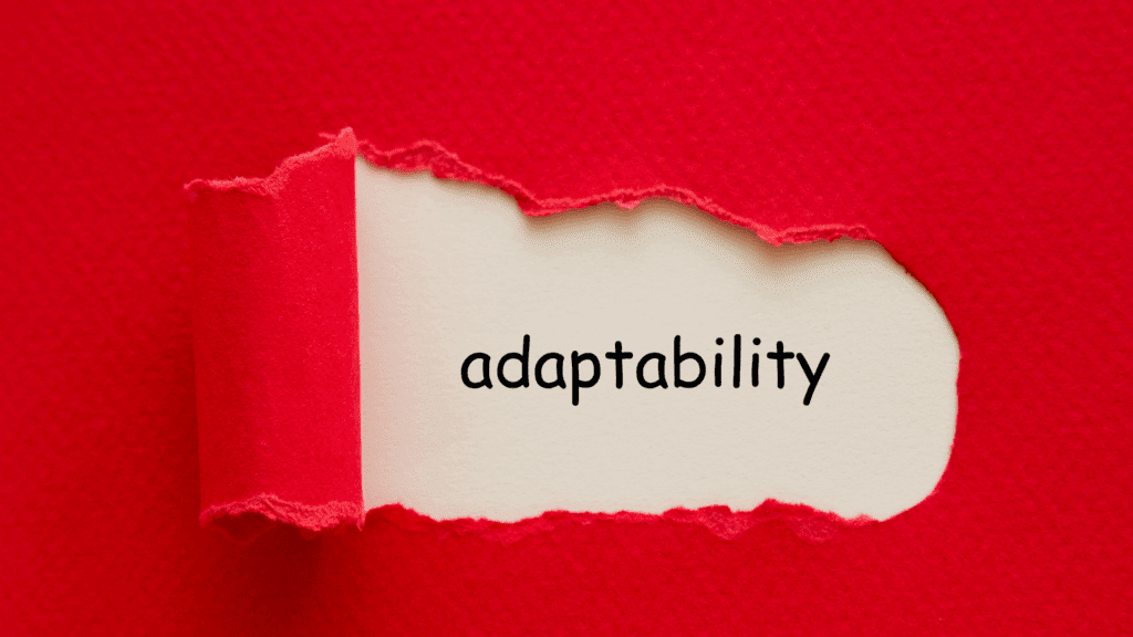 The word adaptability revealed beneath torn red paper, illustrating how adaptability is central in the neuroscience of anxiety.
