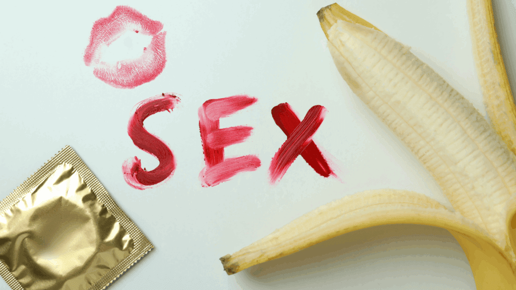 Symbolic representation of sex and addiction with lipstick, banana, and condom illustrating the neuroscience of sex addiction