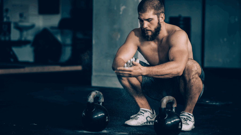 Athletic man in a gym setting reflecting on the neuroscience of sex addiction and its impact on motivation