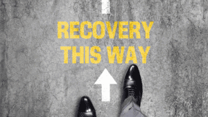 Feet standing before the words "Recovery This Way," symbolizing guidance on how do I stop a panic attack.