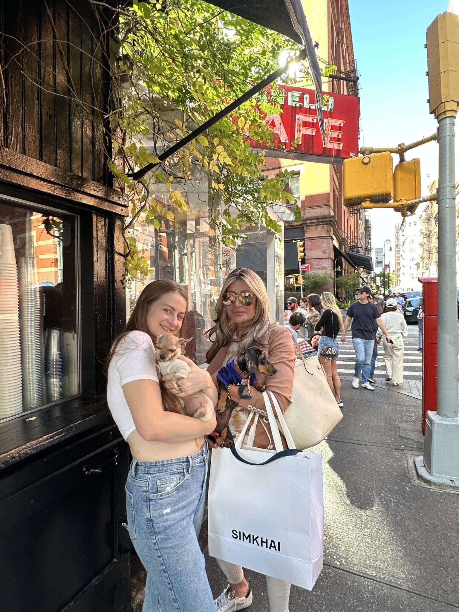 Dr. Sydney Ceruto shopping in SoHo NYC with friend and dogs showing urban lifestyle