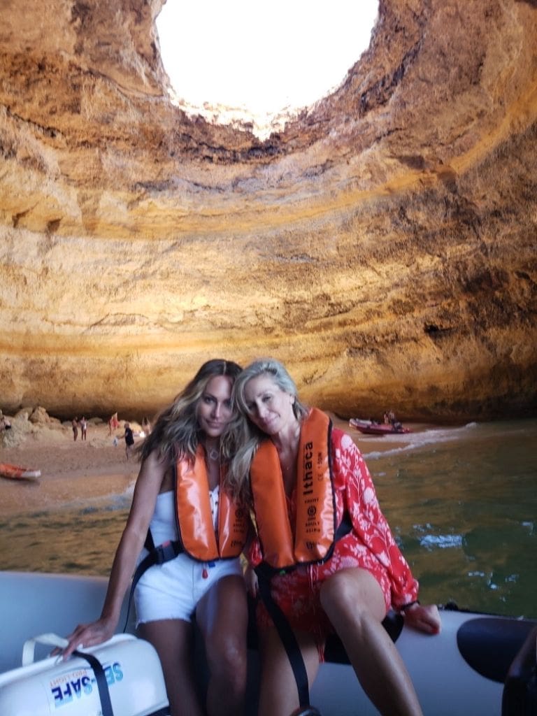 Dr. Sydney Ceruto and a friend wearing life jackets on a boat inside the Benagil sea cave in the Algarve region of Portugal