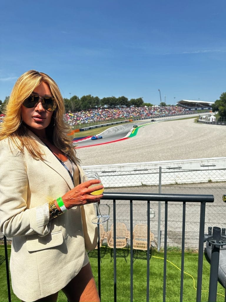 Dr. Sydney Ceruto enjoying the Formula 1 Grand Prix from a VIP terrace overlooking the Circuit de Barcelona-Catalunya racetrack in Spain